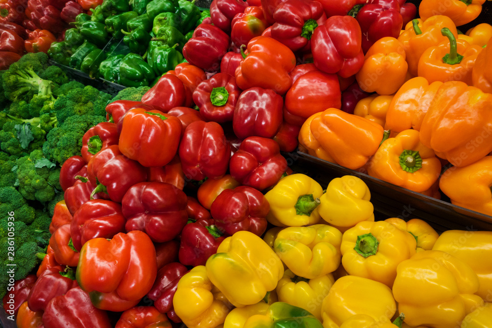 colorful bell and sweet peppers in the store shelf - obrazy, fototapety, plakaty 