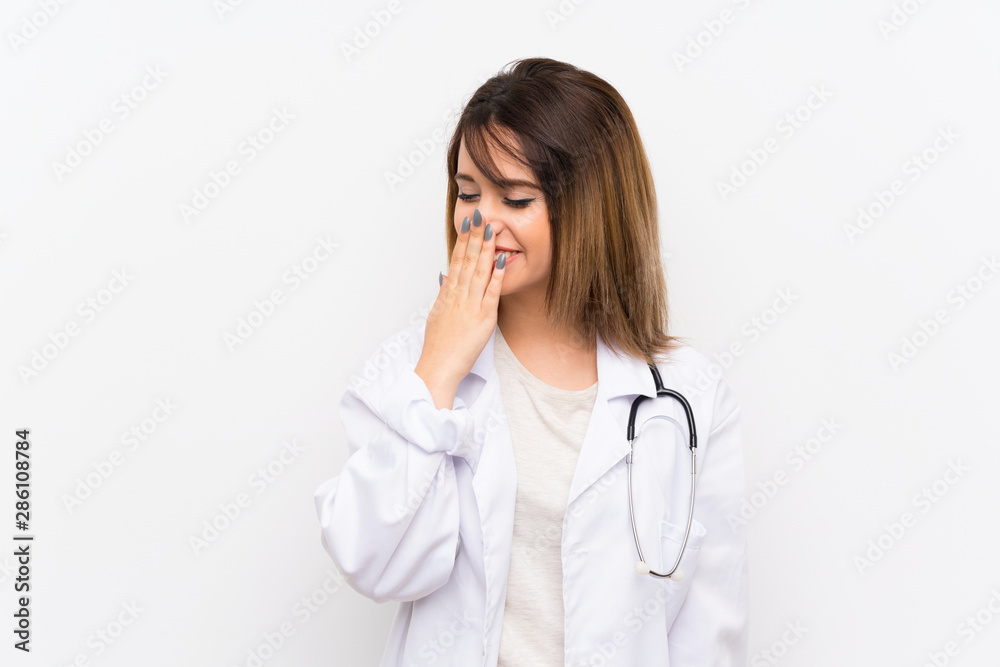 Young doctor woman over isolated background smiling a lot Young doctor woman over isolated background smiling a lot