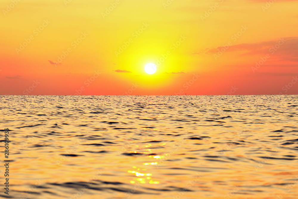 Beautiful sunrise at sea. The sea in the foreground. Background Beautiful sunrise at sea. The sea in the foreground. Background