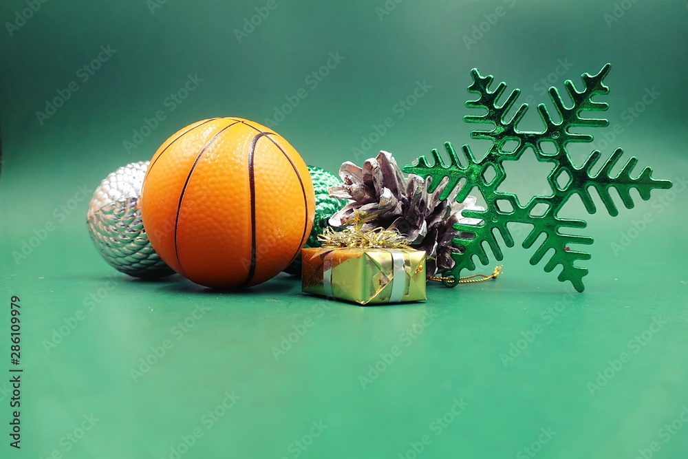 Basketball Christmas with basketball and Christmas ornament on green
