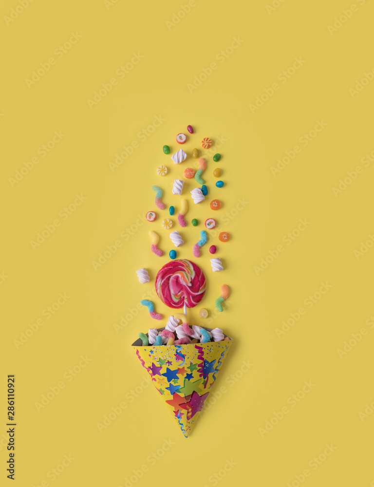 Scattering of sweets on a yellow background. Scattering of sweets on a yellow background.