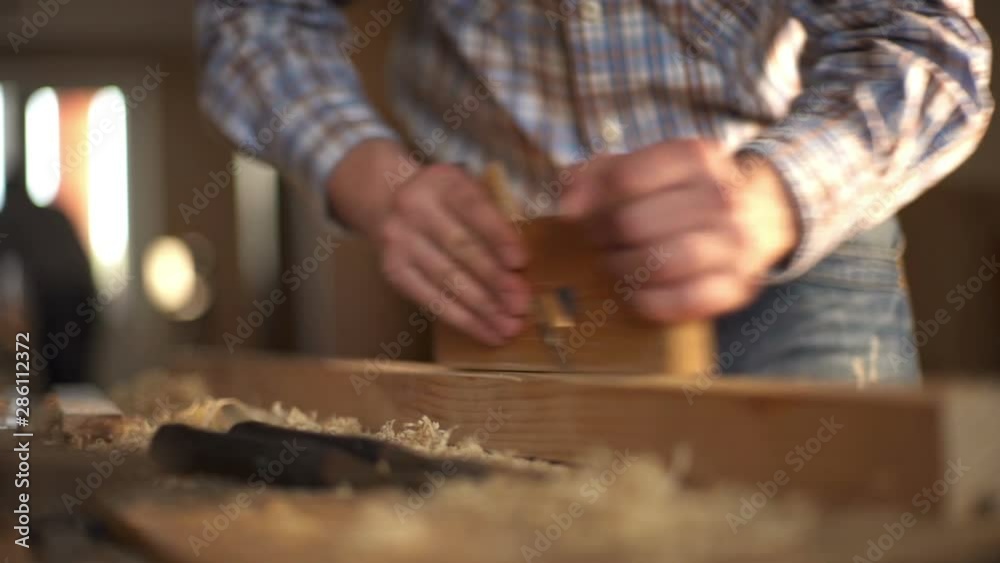 carpenter planed wood, workplace. Slow motion carpenter planed wood, workplace. Slow motion