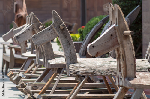 The old wooden vintage rocking horse chair blur background in Thai