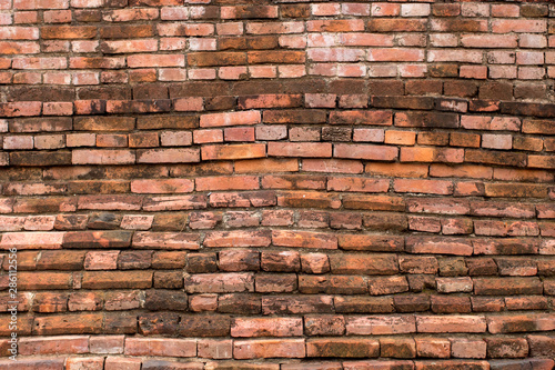 Old historical Asian red brick wall background close up
