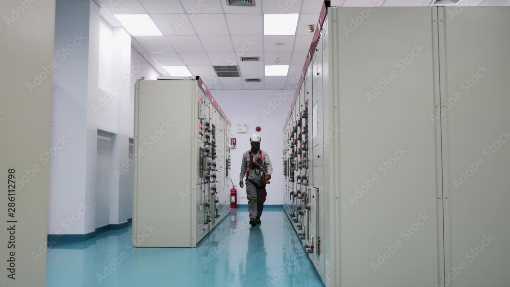 Engineer to check electrical power module in electricity substation ...
