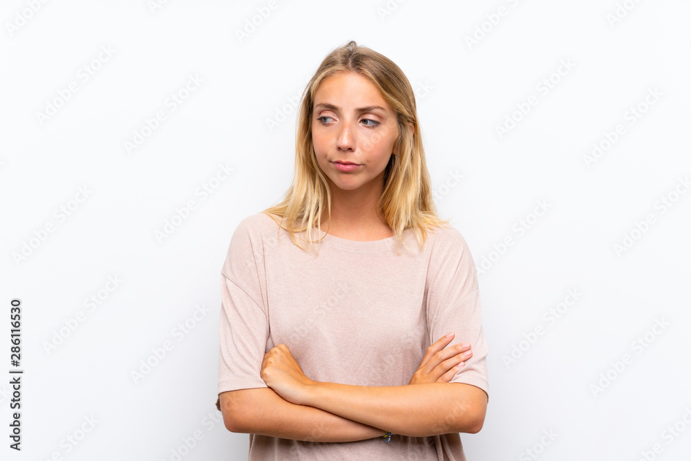 Blonde young woman over isolated white background thinking an idea Blonde young woman over isolated white background thinking an idea