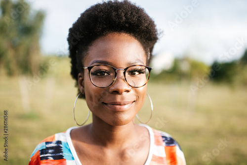 Beautiful african american girl outdoor lifestyle fashion portrait.