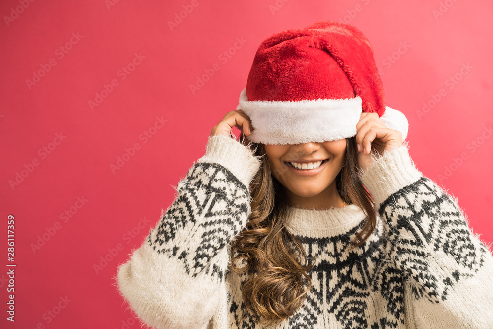 Playful Hispanic Woman Wearing Winter Clothing Playful Hispanic Woman Wearing Winter Clothing