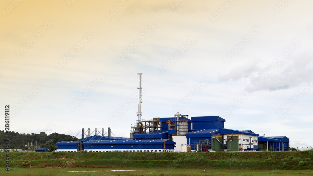 Factory at Industrial Estate with sky and cloud background, Industry or environment concept.