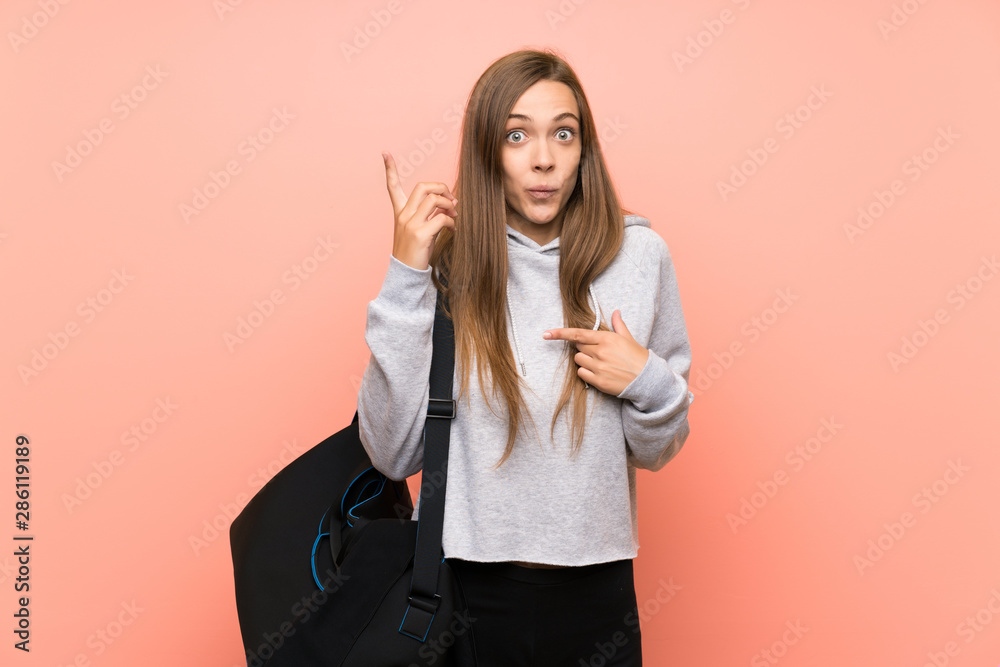Young sport woman over isolated pink background with surprise facial expression Young sport woman over isolated pink background with surprise facial expression