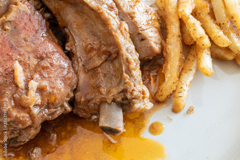 Cooked Pork Ribs with french fries Cooked Pork Ribs with french fries