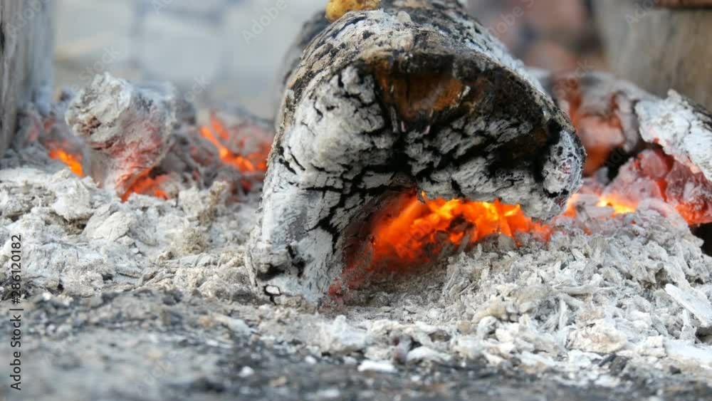 Nice and stylish smoldering and burning wood fire close up view Nice and stylish smoldering and burning wood fire close up view