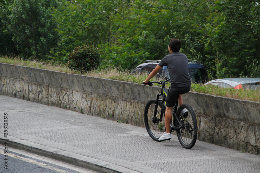 Biker riding in an urban environment