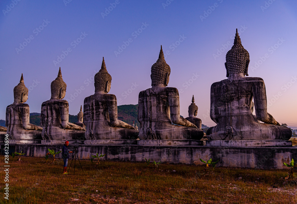 Fototapeta premium Big buddha stature with color of sky twilight, Public in thailand