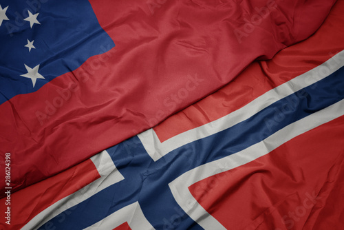 waving colorful flag of norway and national flag of Samoa ,.