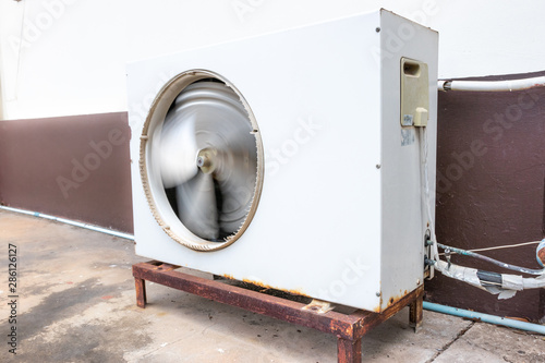 Old air conditioner outdoor unit, The air conditioner rusted. photo