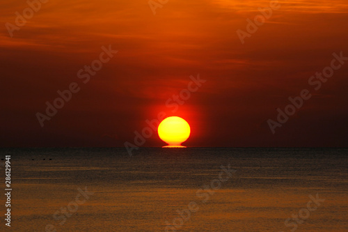peaceful ocean with beautiful sunrise background