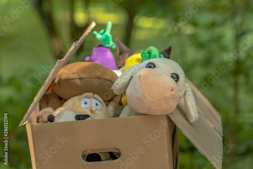 Market stall with objects and children toys sold at the weekend flea market in the city center.  Concept: Old objects for sale