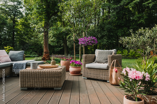 Elegant garden furniture on terrace of suburban home Fototapet