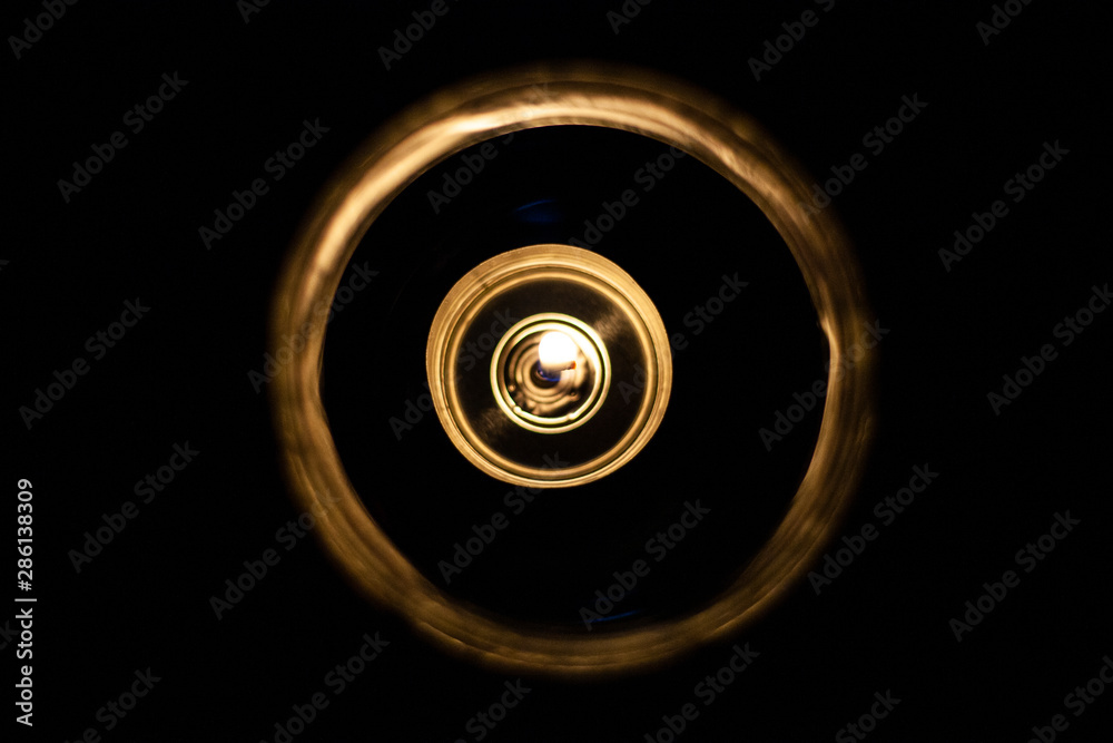 Gorid candle in the dark. Top view of a lit candle Gorid candle in the dark. Top view of a lit candle