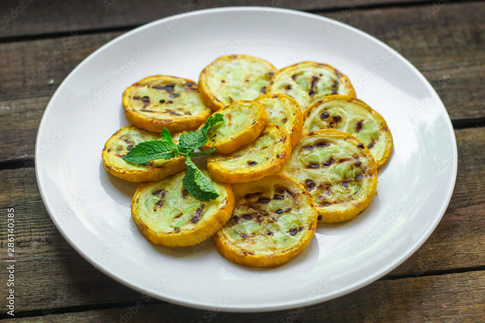 zucchini yellow fried grill (delicious vegetable dish) menu. top food background. copy space zucchini yellow fried grill (delicious vegetable dish) menu. top food background. copy space