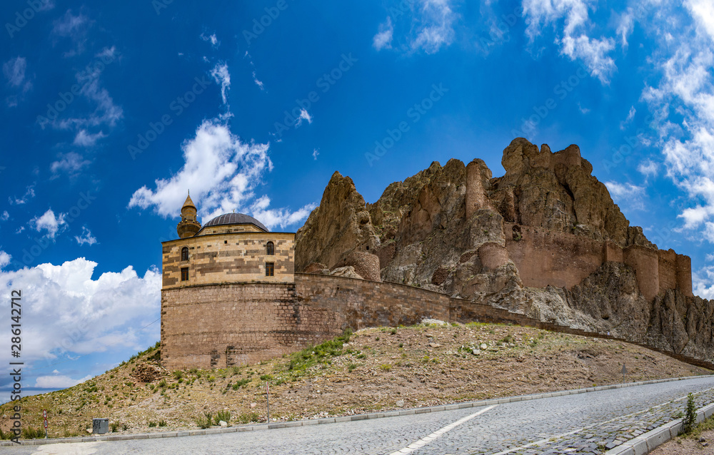 Dogubayazıt, Turkey, Middle East: panoramic view of Eski Bayezid Cami, the mosque located near the famous Ishak Pasha Palace, with the ancient castle of Old Beyazit on the road up to the mountains