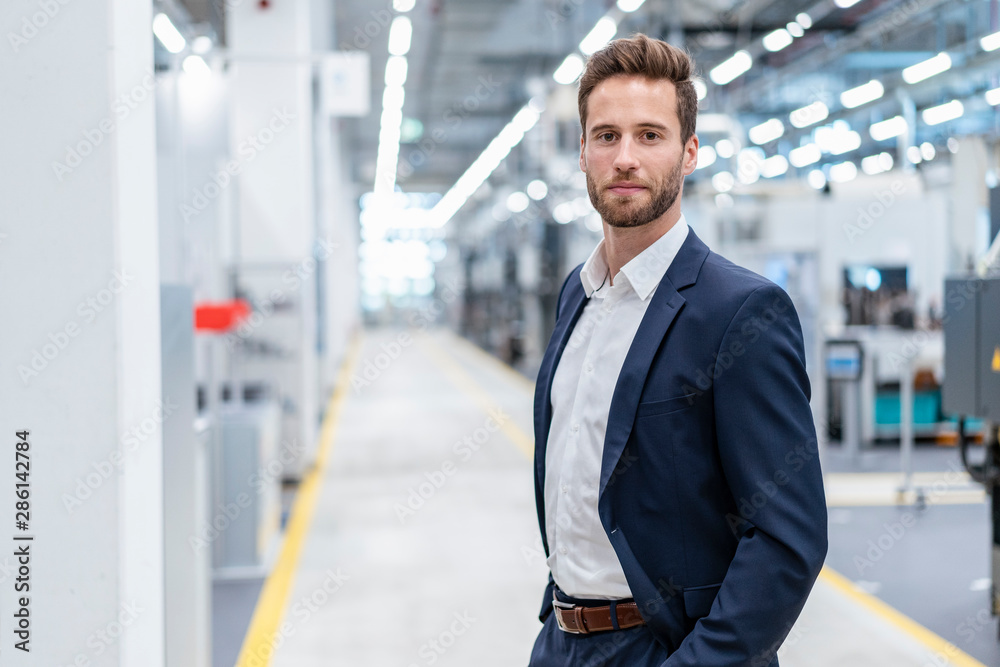 Portrait of a confident businessman in a modern factory Portrait of a confident businessman in a modern factory