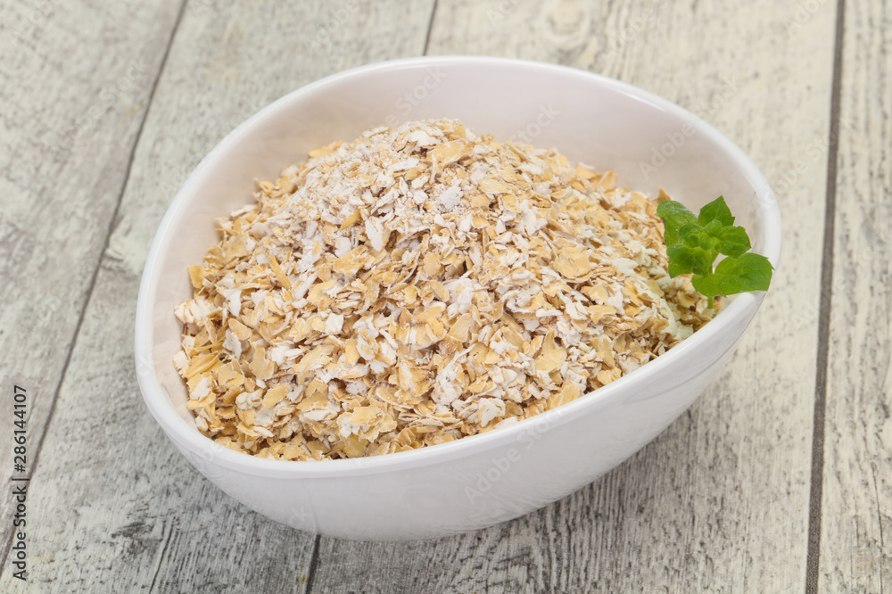 Raw oats in the bowl Raw oats in the bowl