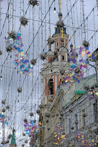 Nikolskaya Street buildings seen through hanging ornaments