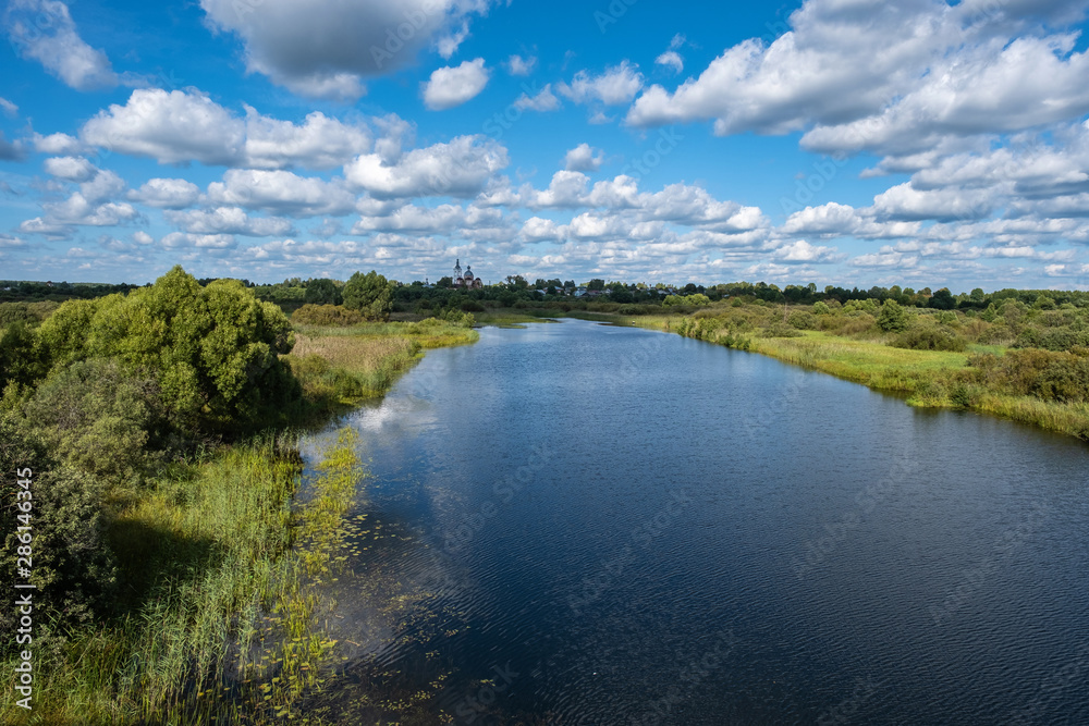 Summer rural landscape with the Lukh River in the village of Myt, Russia. Summer rural landscape with the Lukh River in the village of Myt, Russia.