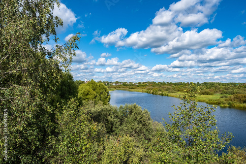 Summer rural landscape with the Lukh River in the village of Myt, Russia. photo