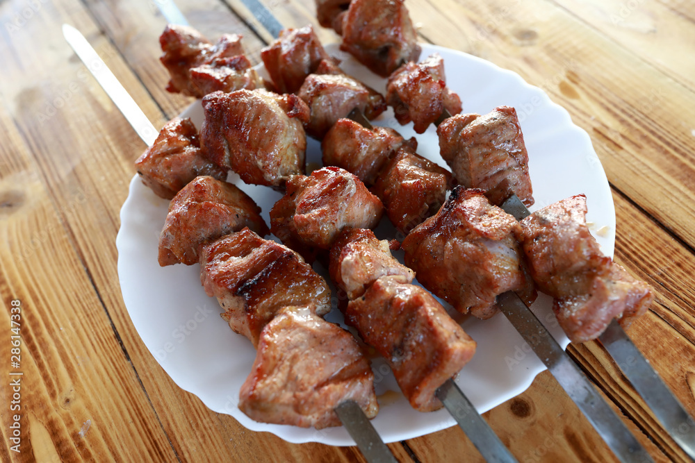 Plate with pork neck kebabs