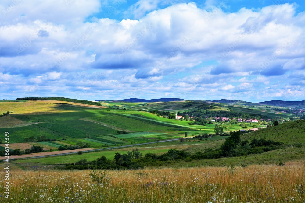 A beautiful rural landscape in Transylvania. Village of Hodosa Mures county - Romania
A beautiful rural landscape in Transylvania. Village of Hodosa Mures county - Romania