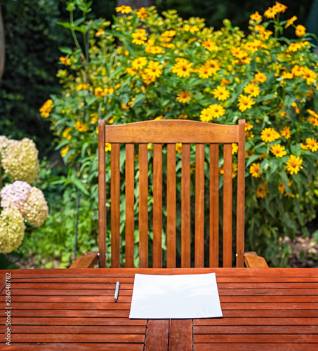 Wooden table with a sheet o...