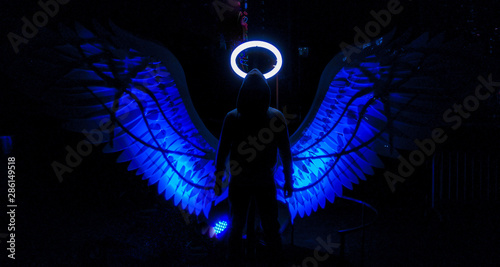 Hooded Guy Silhouette with Blue color Angel Wings and nimbus photo