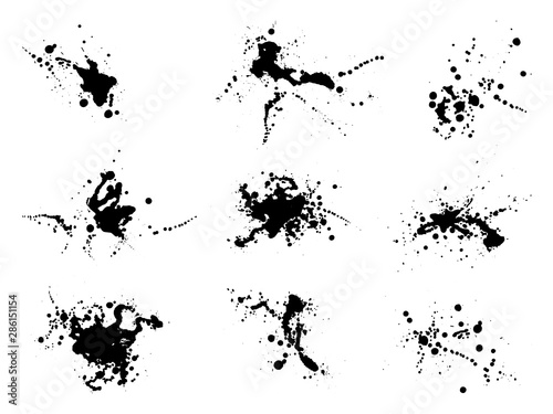 Grunge splatter set. Ink stains design elements. Spray splashes collection. Liquid stains isolated. Abstract vector illustration.