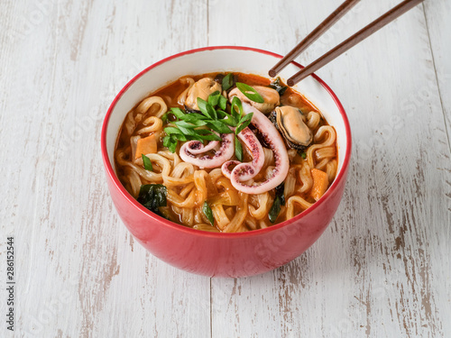 noodles soup with seafood, close up photo