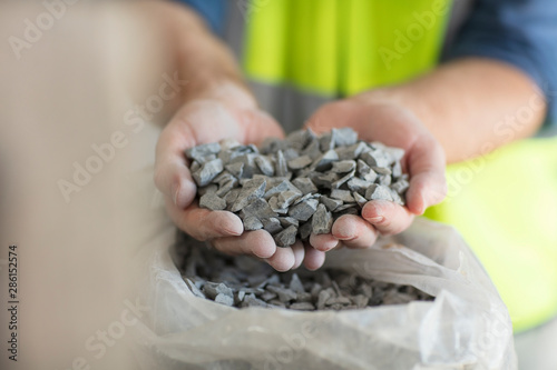 Worker holding gravel photo