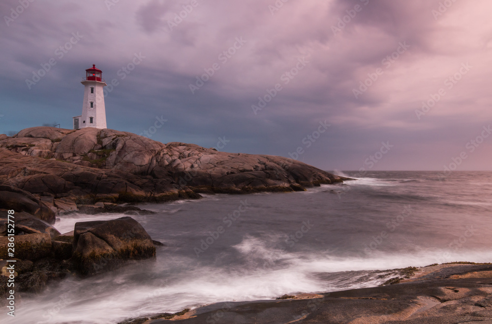 Lighthouse on rocky coastline Lighthouse on rocky coastline