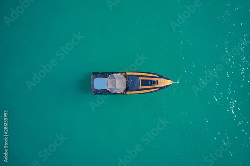 luxury yacht on blue water top view