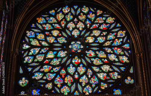  Stained glass window in Poissy collegiate church, Paris, France © Nattawit