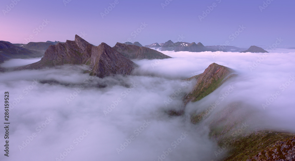Panoramic view of misty mountains in Norway, Senja