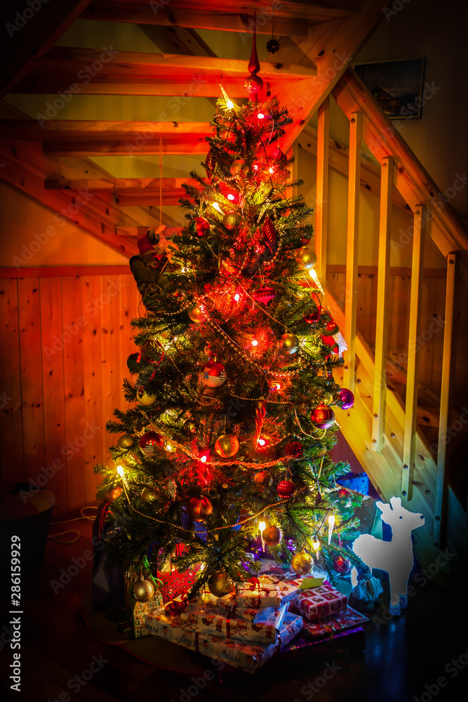 Christmas scene with tree and gifts at home