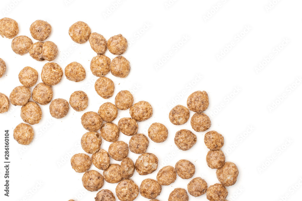 Lot of whole crispy chocolate ball breakfast cereals flatlay isolated on white background Lot of whole crispy chocolate ball breakfast cereals flatlay isolated on white background