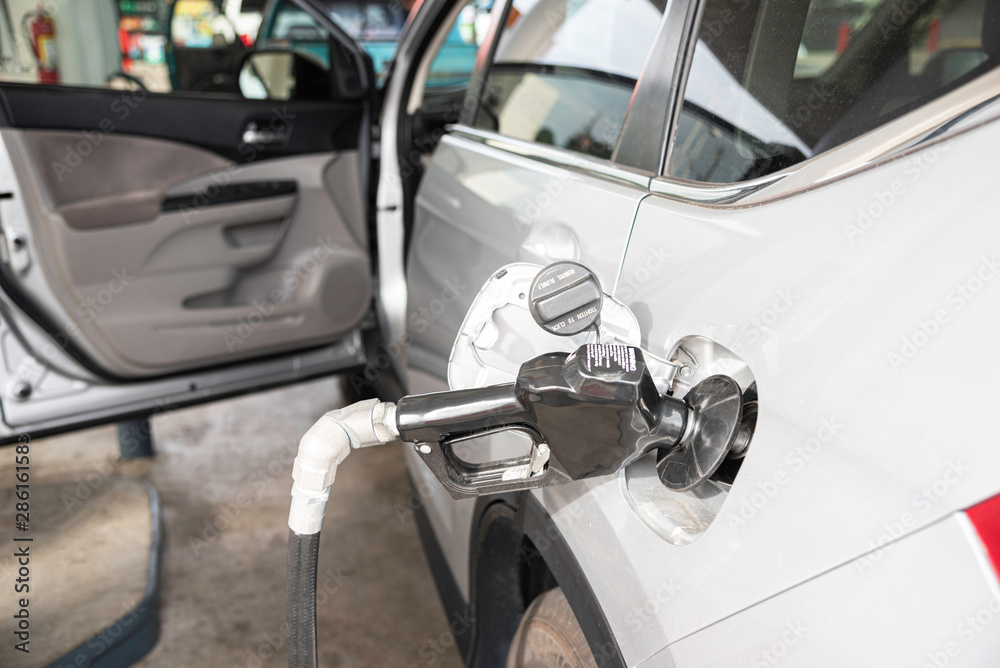 Filling A Vehicle’s Fuel Tank At A Gas Station