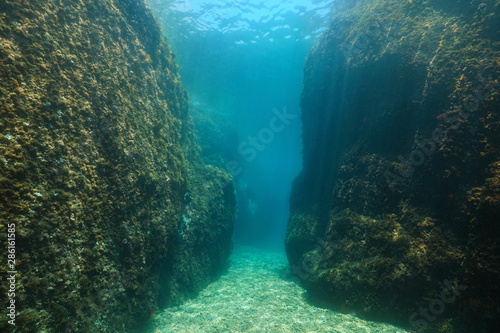 A narrow passage between large rocks underwater in the Mediterranean sea, Spain, Costa Brava, Aigua Xelida, Palafrugell, Catalonia