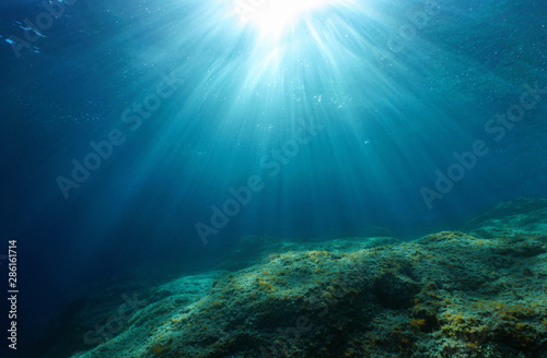 Natural sunlight and rocky seabed underwater in the Mediterranean sea, Cote d'Azur, France