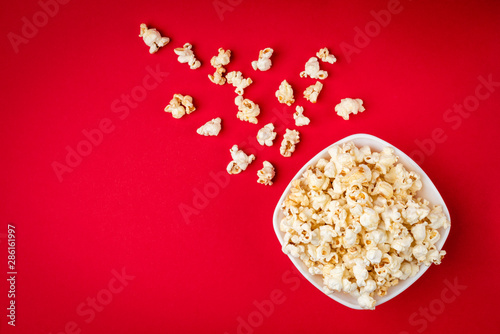 Popcorn on red background.