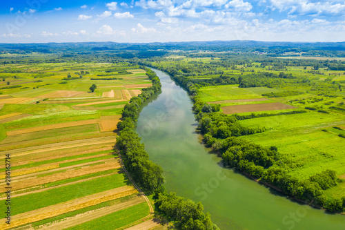Fotografie Rural countryside landscape in Croatia, Kupa river meandering between agricultur