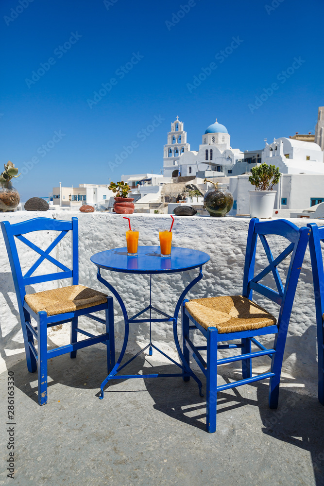 Fototapeta premium Table in a street cafe in Greece